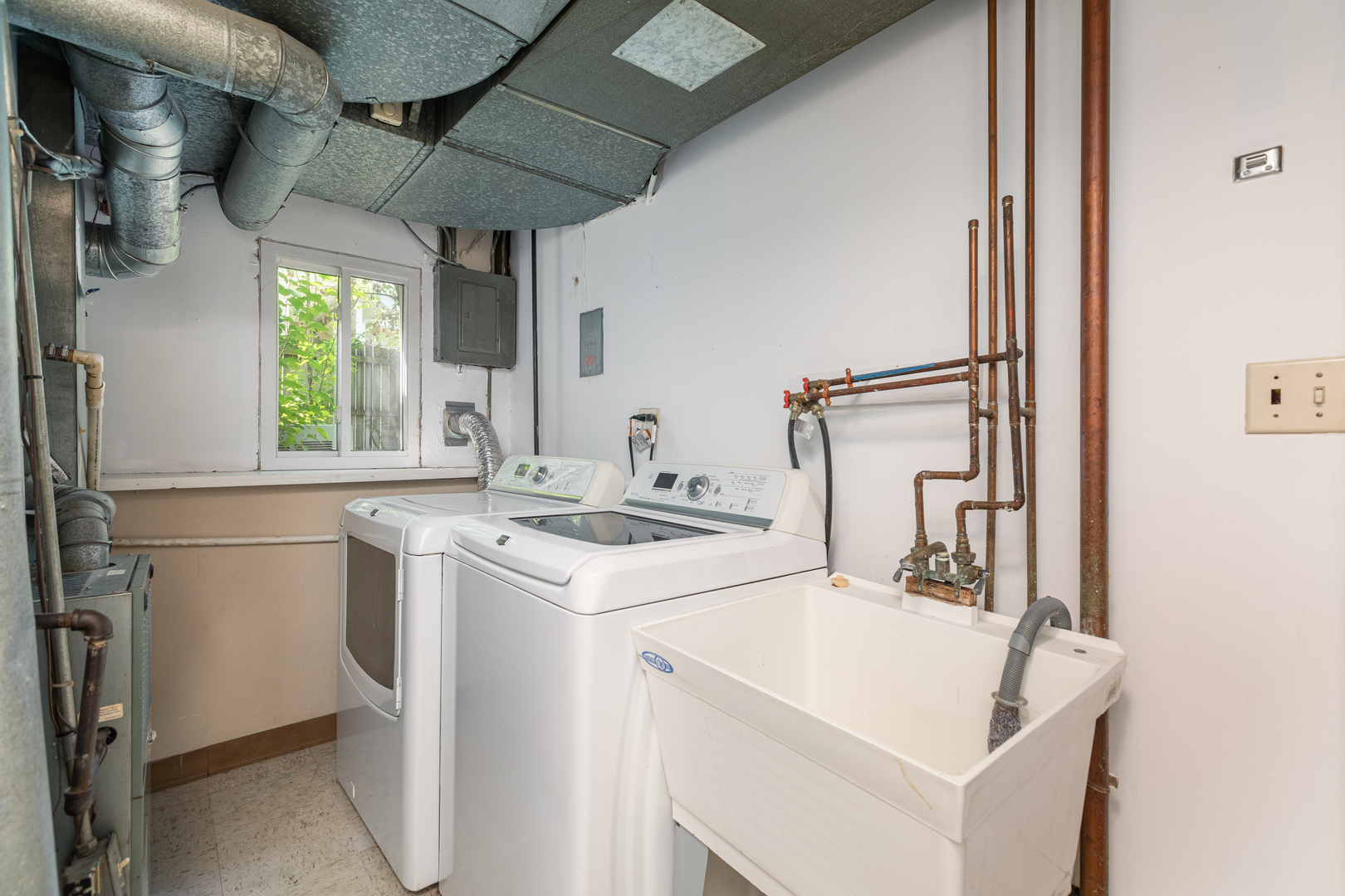 5740 Wolf Road Western Springs, IL 60558 - Photo 12 of 26 a utility room with dryer and washer