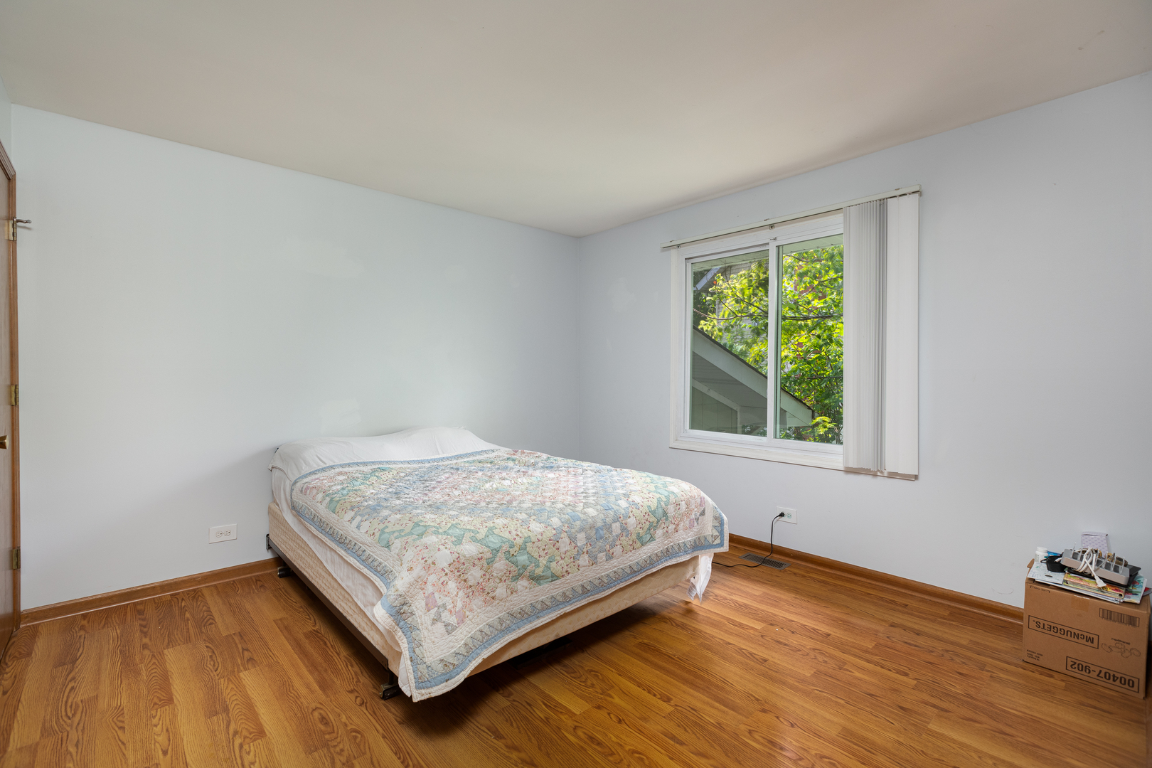 5740 Wolf Road Western Springs, IL 60558 - Photo 13 of 26 a bedroom with a bed and a window
