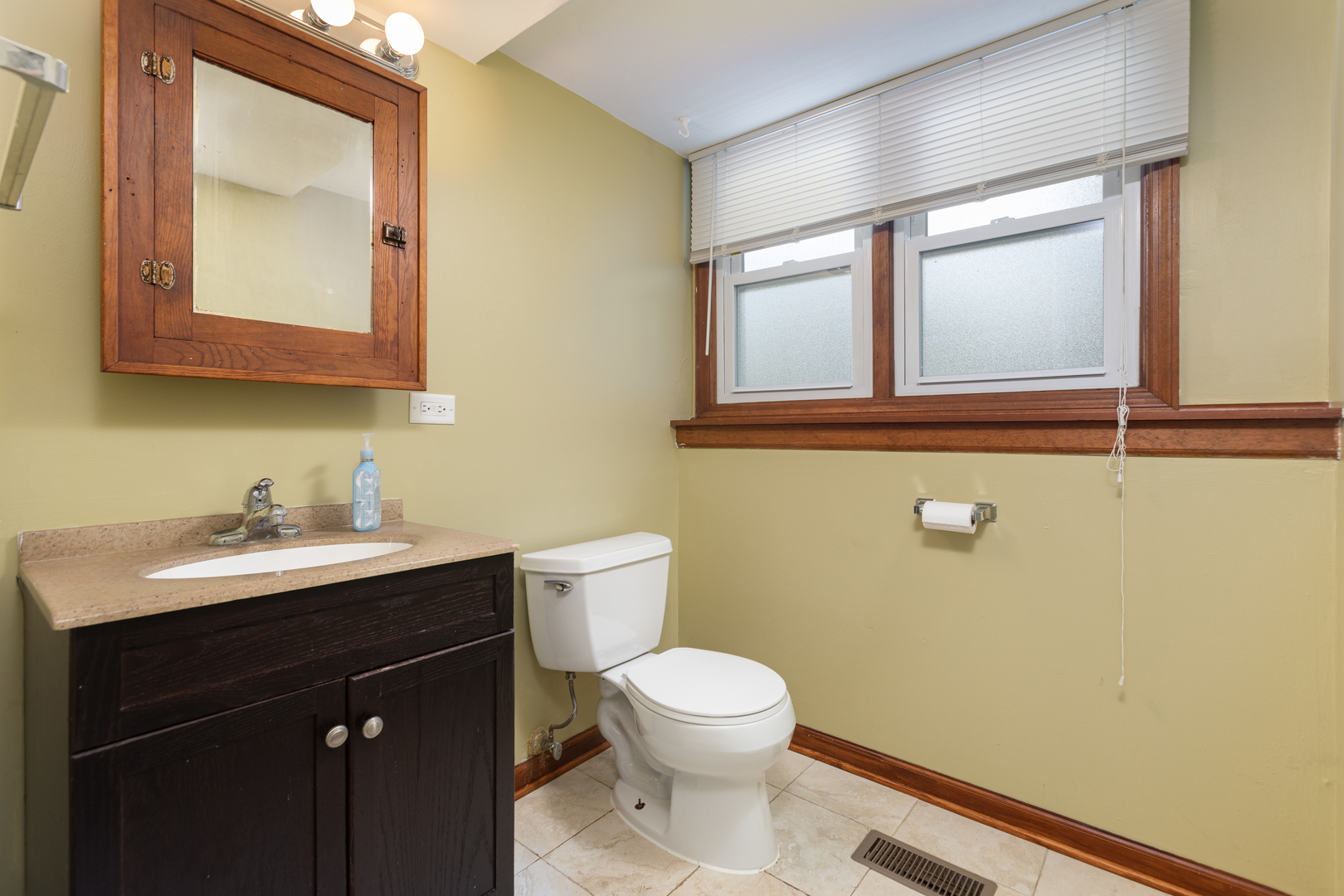 5740 Wolf Road Western Springs, IL 60558 - Photo 19 of 26 a bathroom with a toilet a sink and mirror