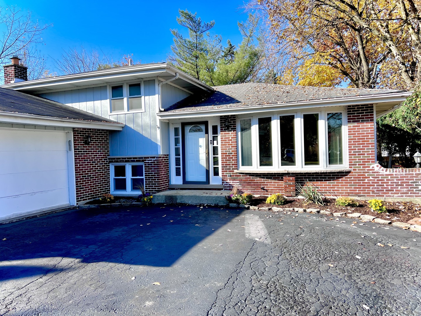 5740 Wolf Road Western Springs, IL 60558 - Photo 2 of 26 a front view of a house with a yard