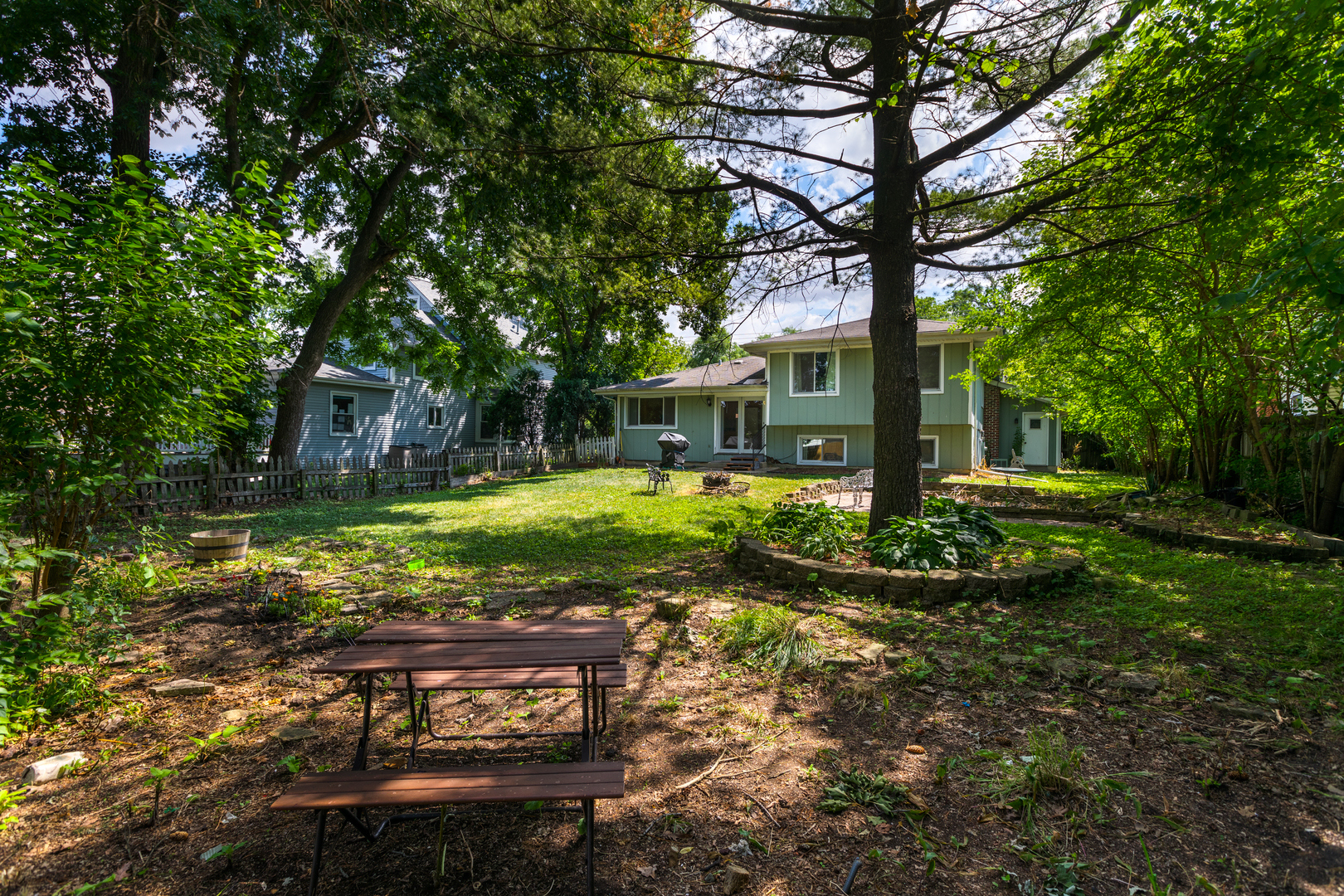 5740 Wolf Road Western Springs, IL 60558 - Photo 25 of 26 a view of a yard with plants and large trees