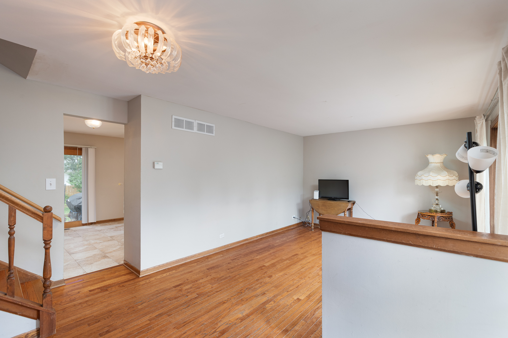 5740 Wolf Road Western Springs, IL 60558 - Photo 10 of 26 a view of a room with wooden floor and workspace