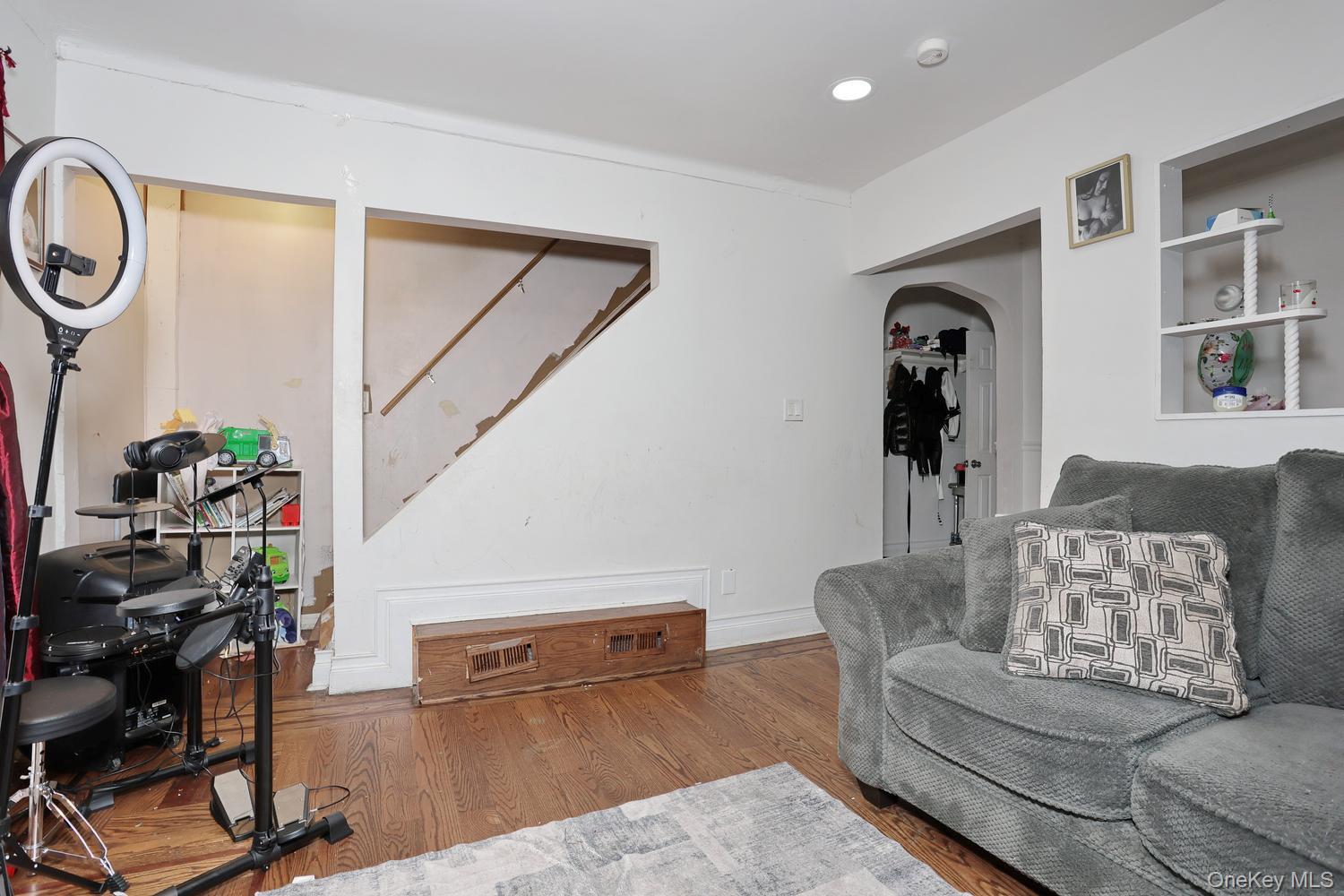 29 Fairview Avenue Spring Valley, NY 10977 - Photo 15 of 19 a living room with furniture and a wooden floor