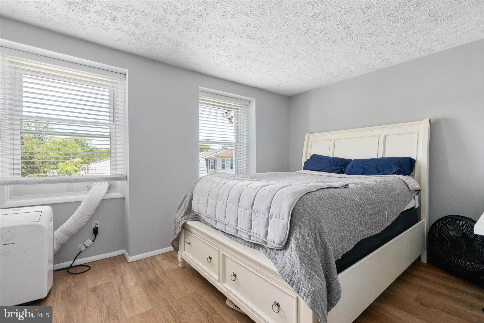8307 Crestmont Circle Springfield, VA 22153 - Photo 14 of 33 a bedroom with a bed and a desk