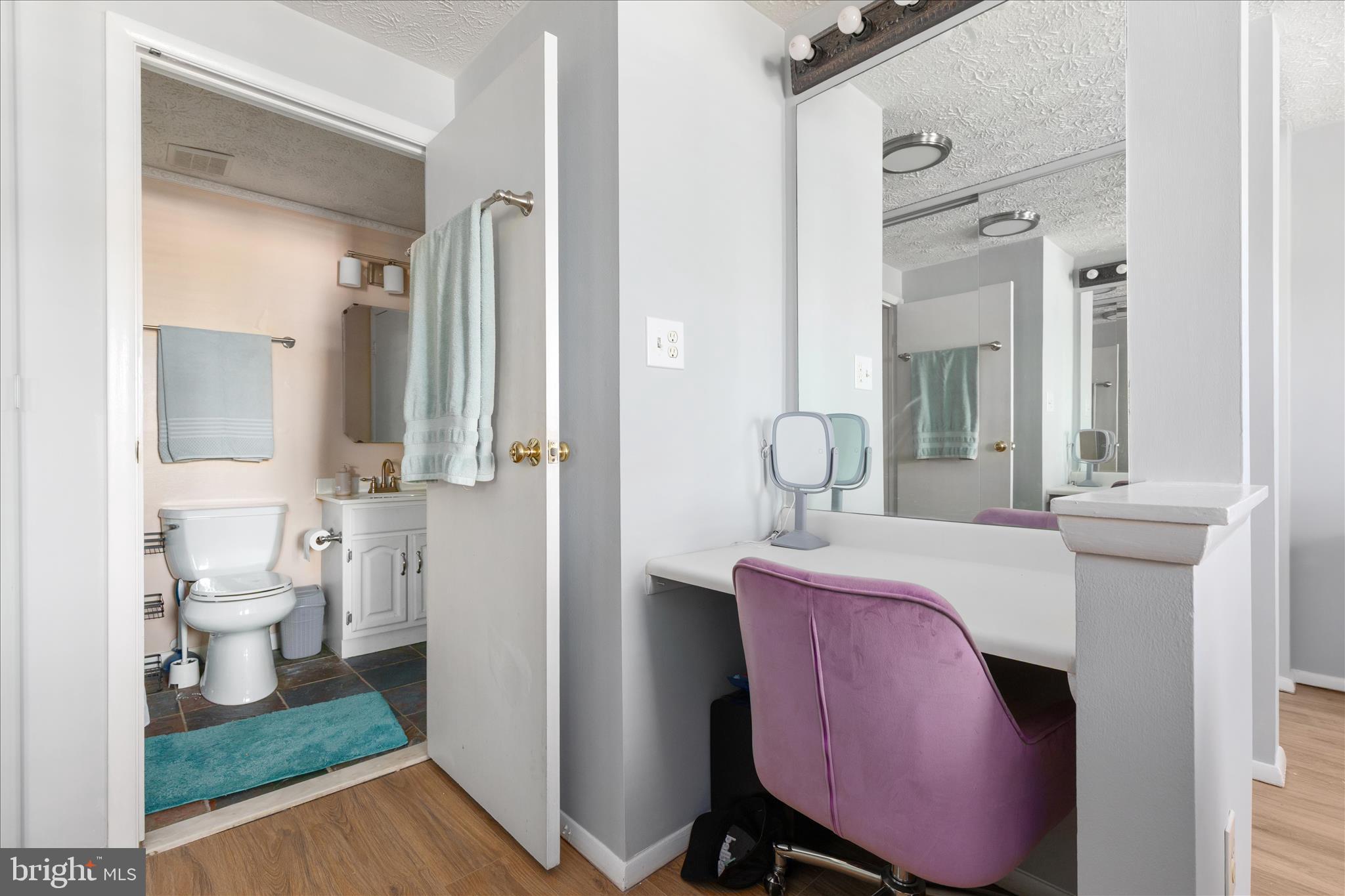 8307 Crestmont Circle Springfield, VA 22153 - Photo 16 of 33 a bathroom with a sink mirror toilet and shower