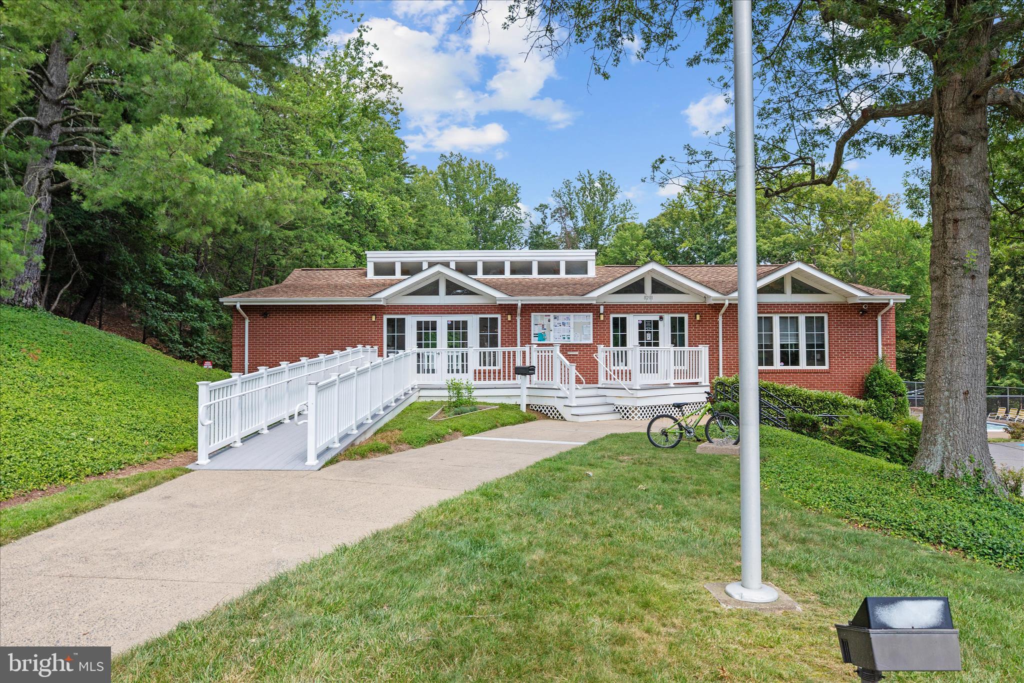8307 Crestmont Circle Springfield, VA 22153 - Photo 30 of 33 a front view of a house with a yard table and chairs