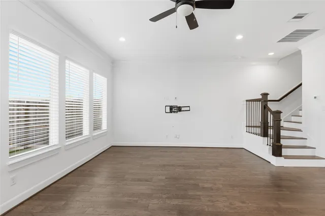 a view of an empty room with kitchen appliances