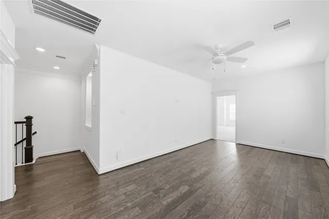 a room with pool table and windows