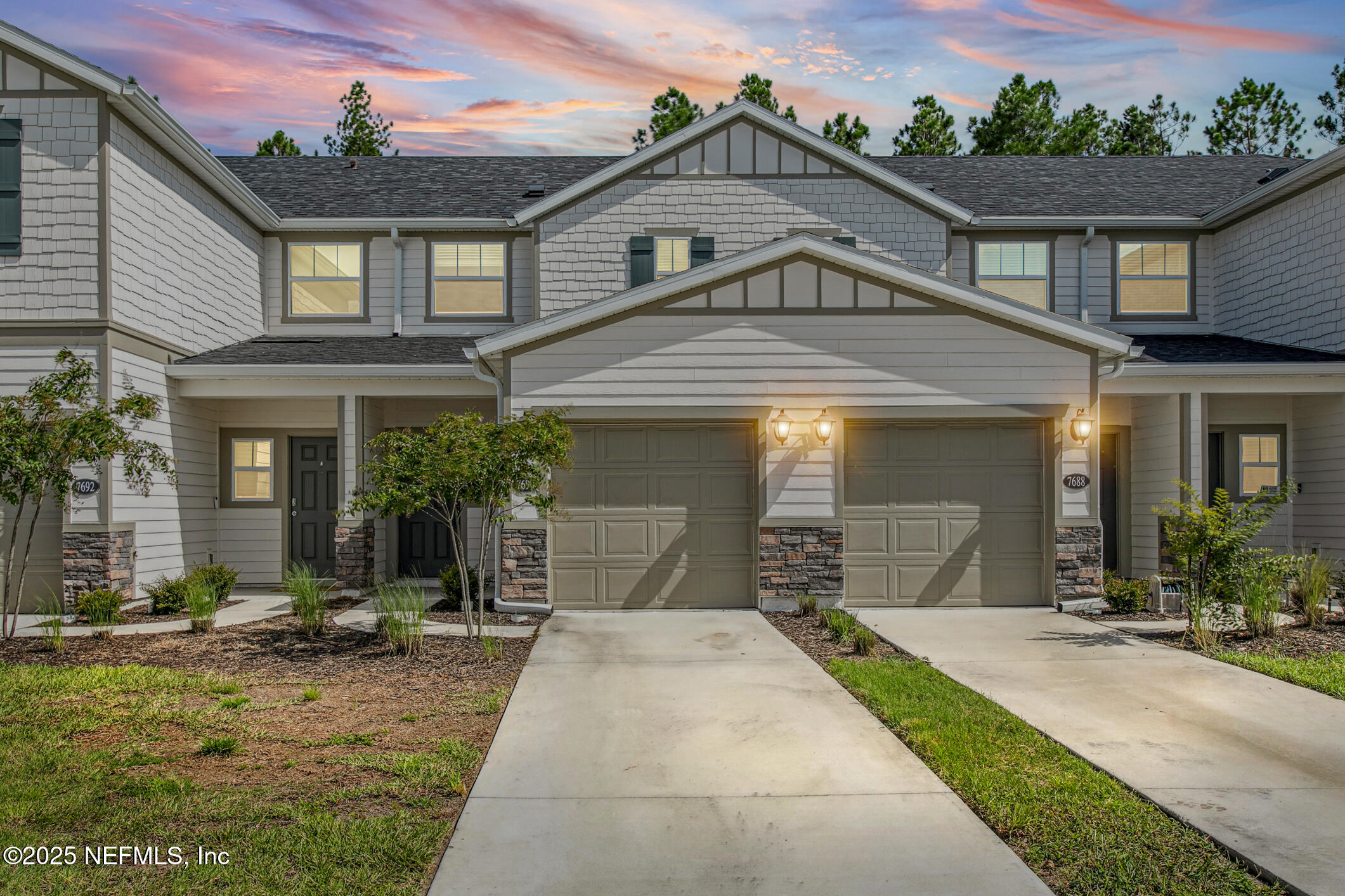 7690 Merchants Way Jacksonville, FL 32222 - Photo 1 of 52 front view of a house with a yard