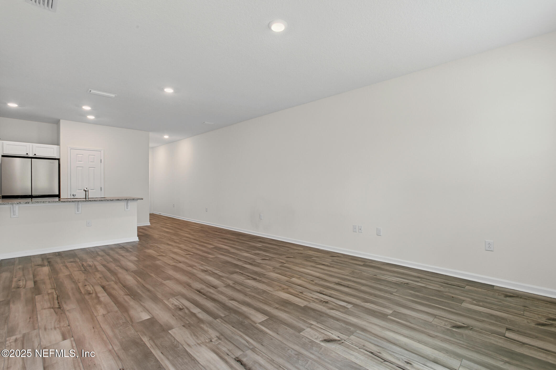 7690 Merchants Way Jacksonville, FL 32222 - Photo 19 of 52 a view of empty room with wooden floor