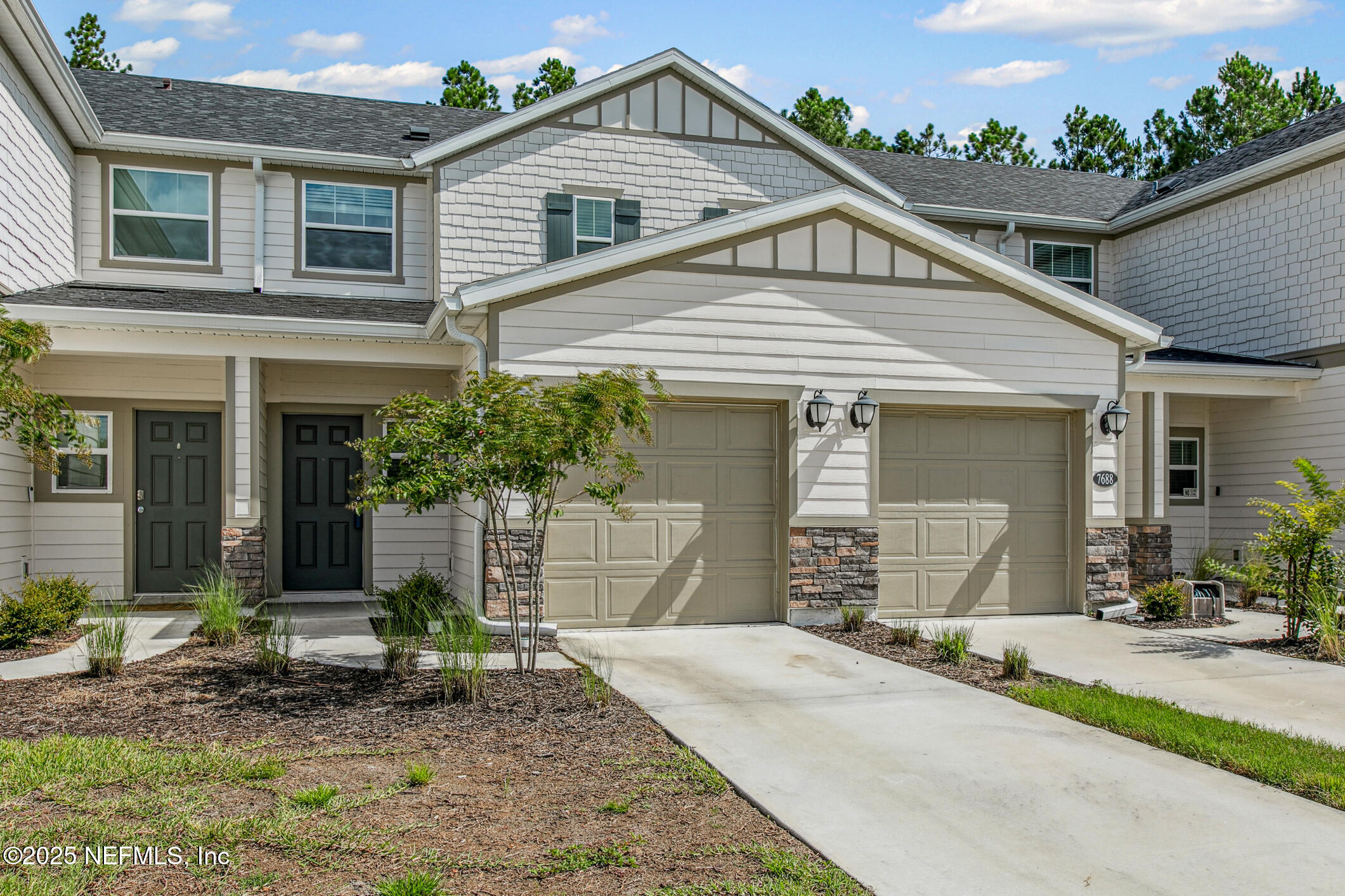 7690 Merchants Way Jacksonville, FL 32222 - Photo 2 of 52 front view of a house with a yard