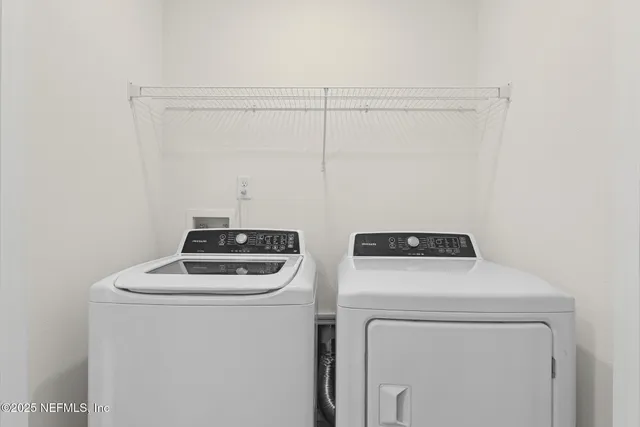 a utility room with dryer and washer