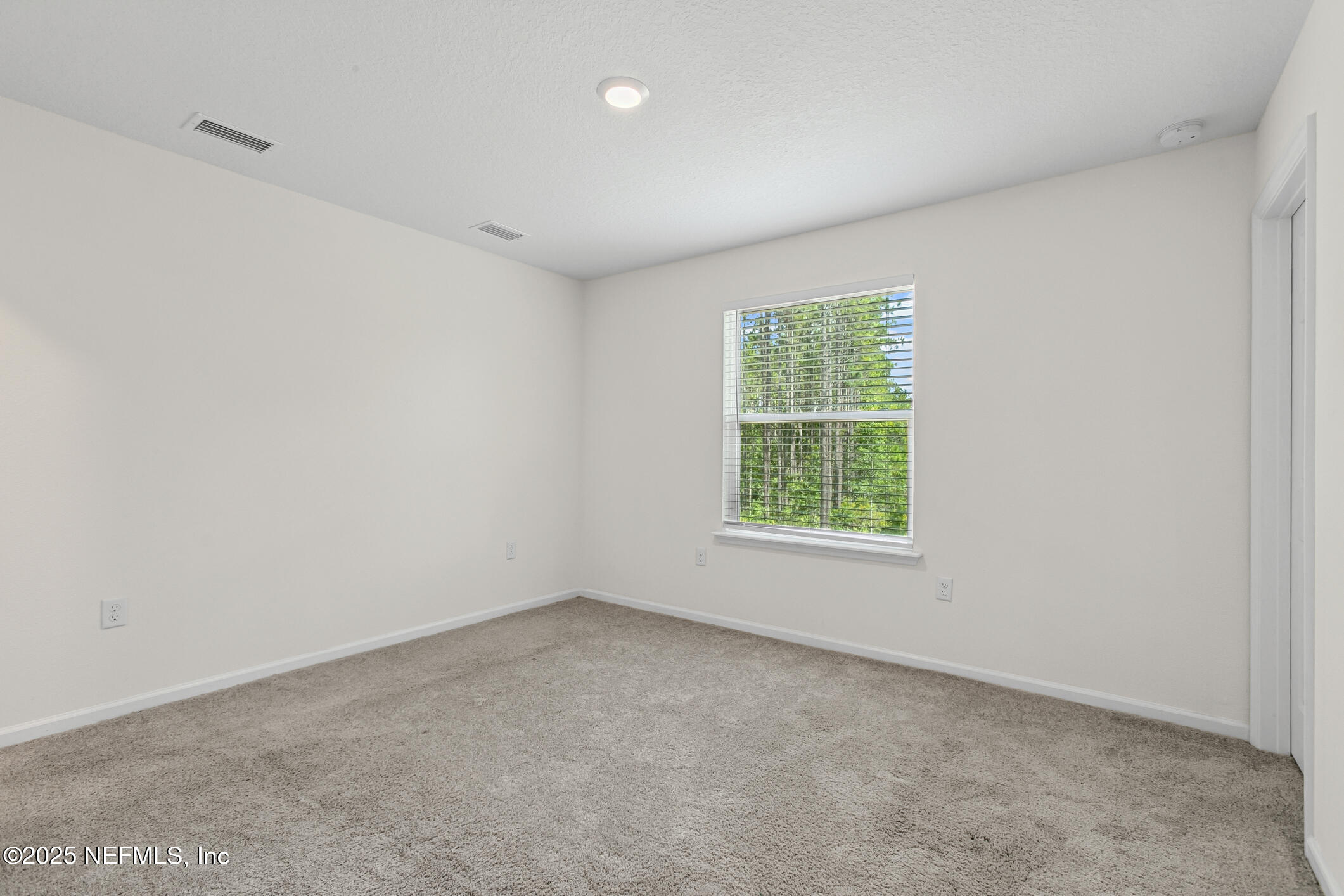7690 Merchants Way Jacksonville, FL 32222 - Photo 24 of 52 an empty room with windows