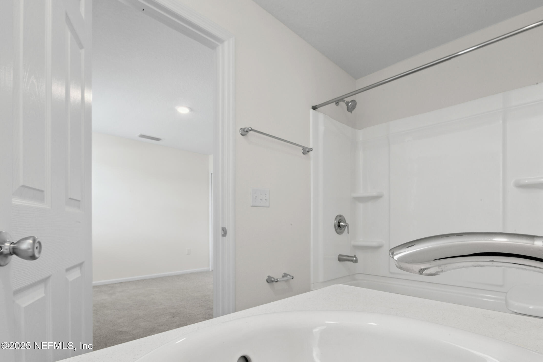7690 Merchants Way Jacksonville, FL 32222 - Photo 30 of 52 a bathroom with a bathtub and a shower