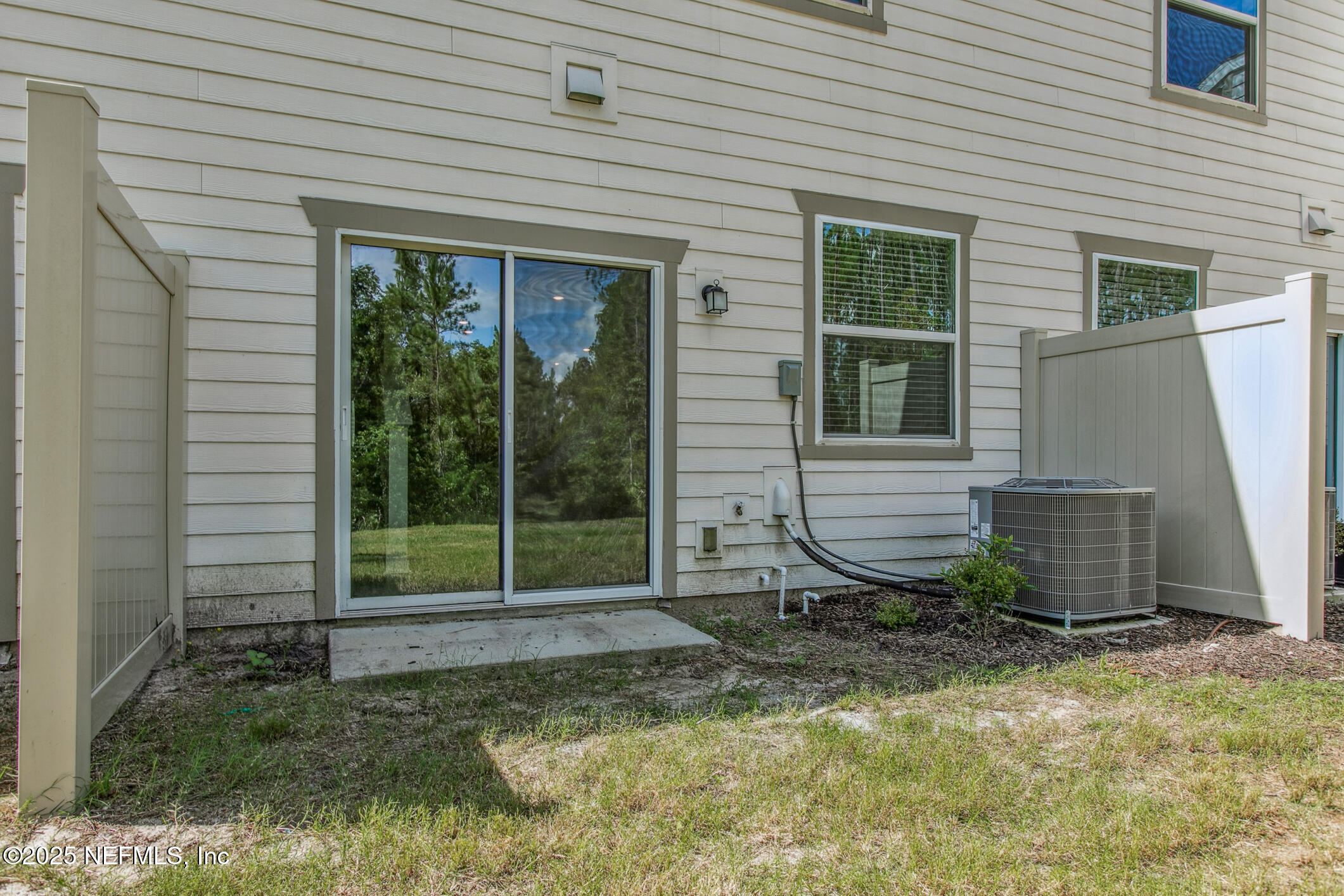 7690 Merchants Way Jacksonville, FL 32222 - Photo 35 of 52 a house with trees in the background