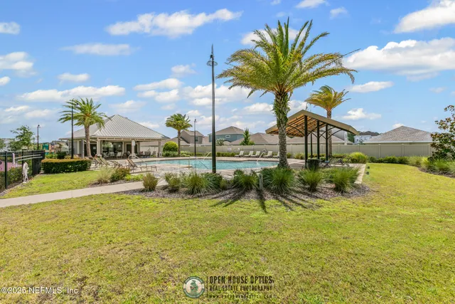a view of a palm tree in front of a building