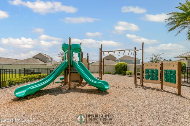a building with a view of palm trees