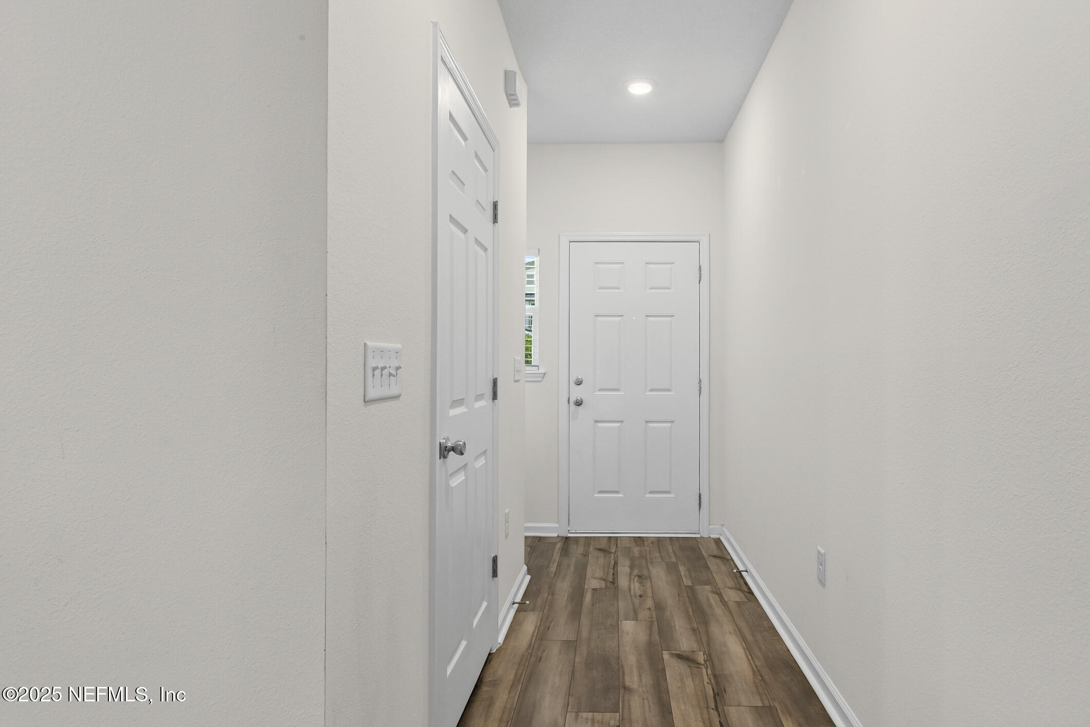 7690 Merchants Way Jacksonville, FL 32222 - Photo 8 of 52 a view of a hallway with wooden floor