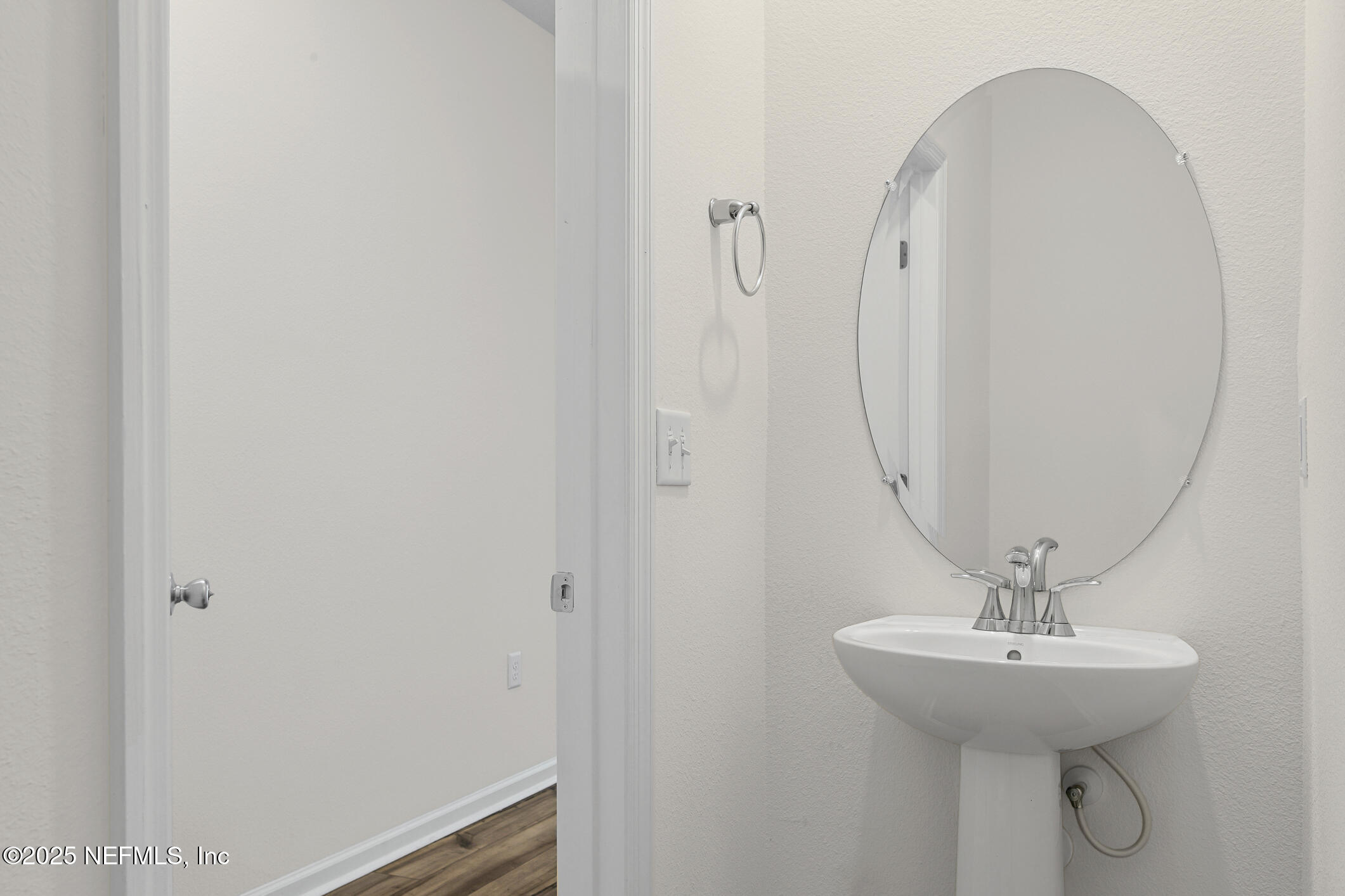 7690 Merchants Way Jacksonville, FL 32222 - Photo 9 of 52 a bathroom with a sink and a mirror
