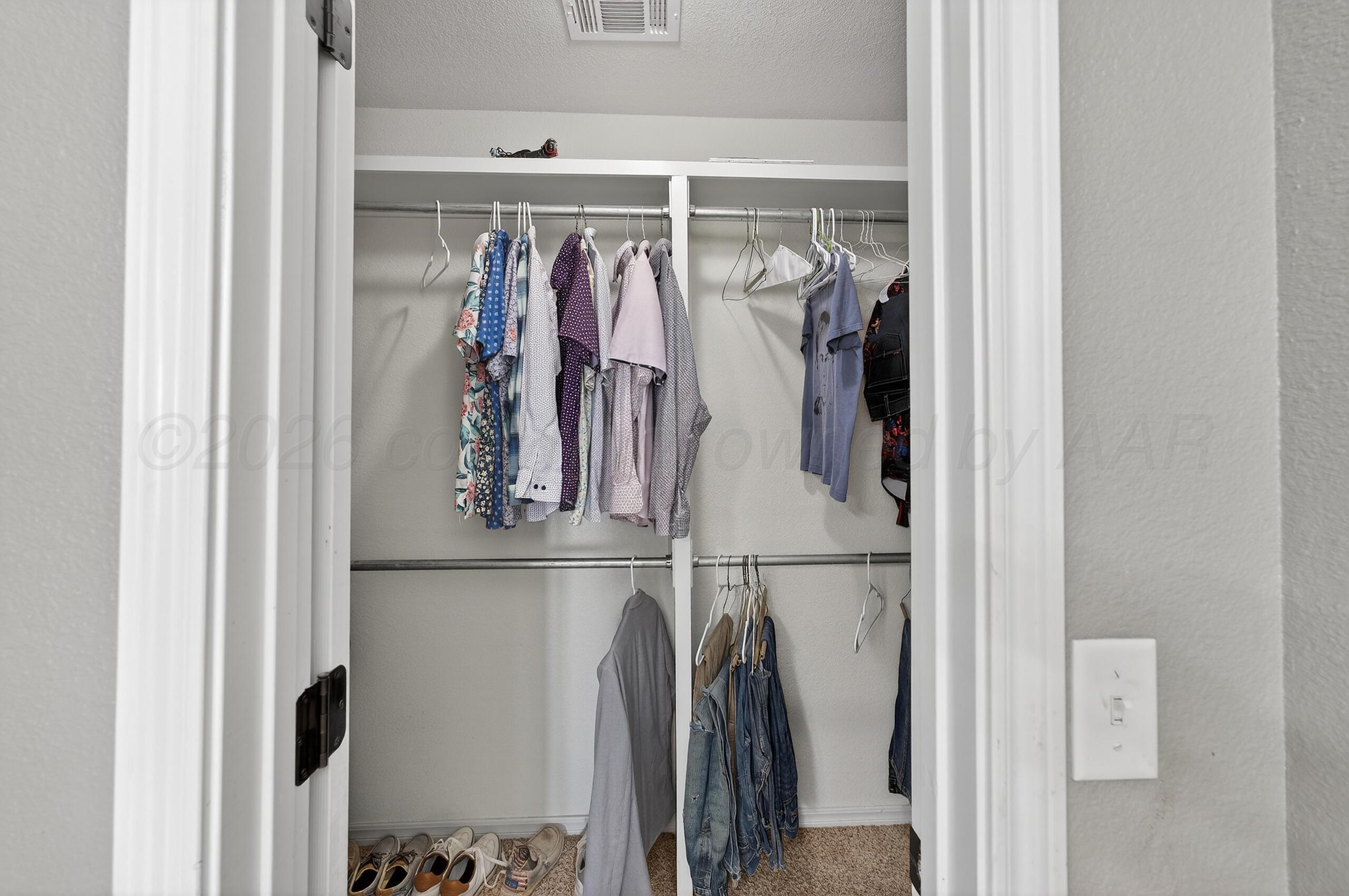 383 County Road 309 Panhandle, TX 79068 - Photo 20 of 35 a view of walk in closet with clothes and shoes