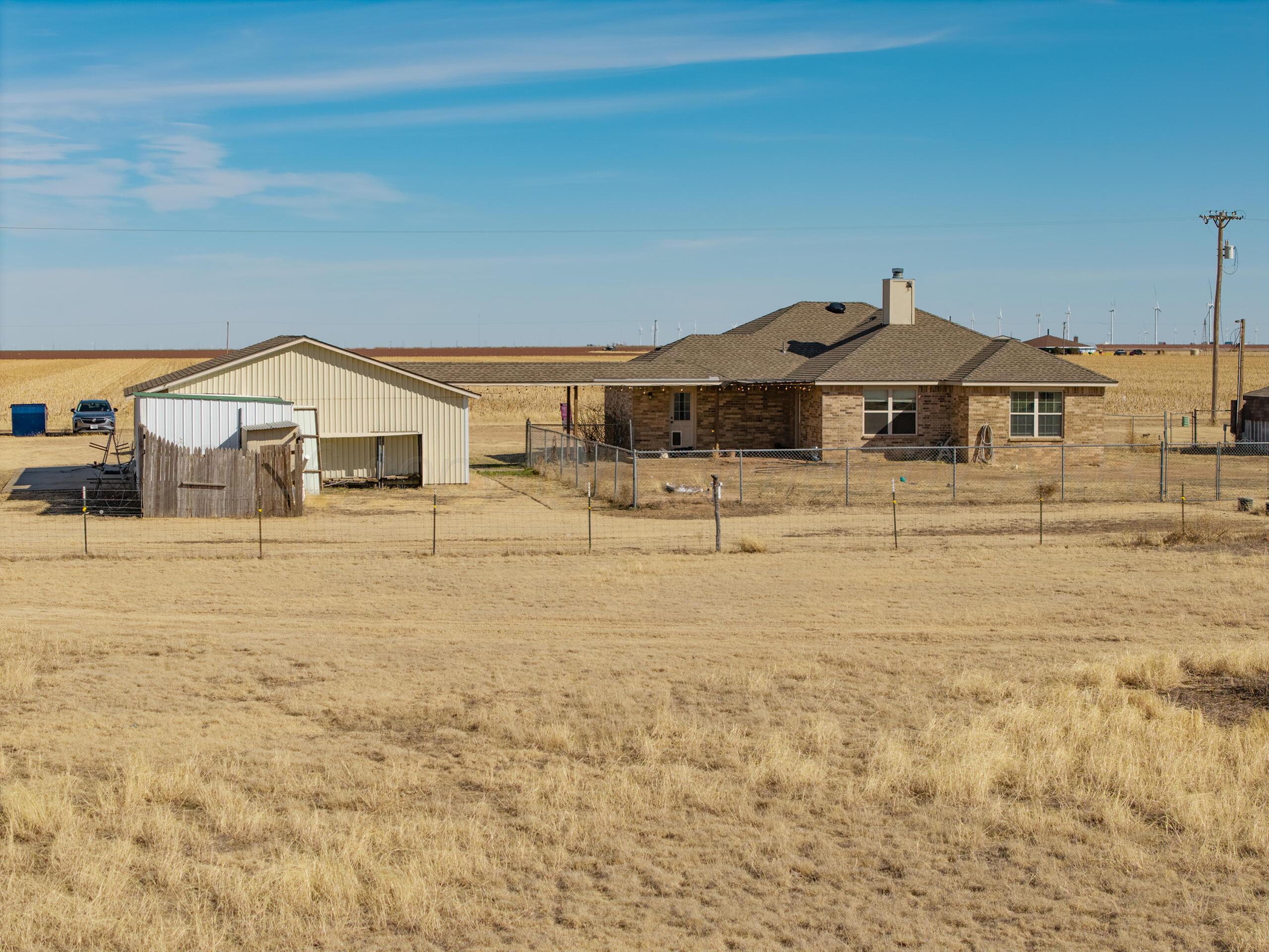 383 County Road 309 Panhandle, TX 79068 - Photo 27 of 35 a front view of a house with parking