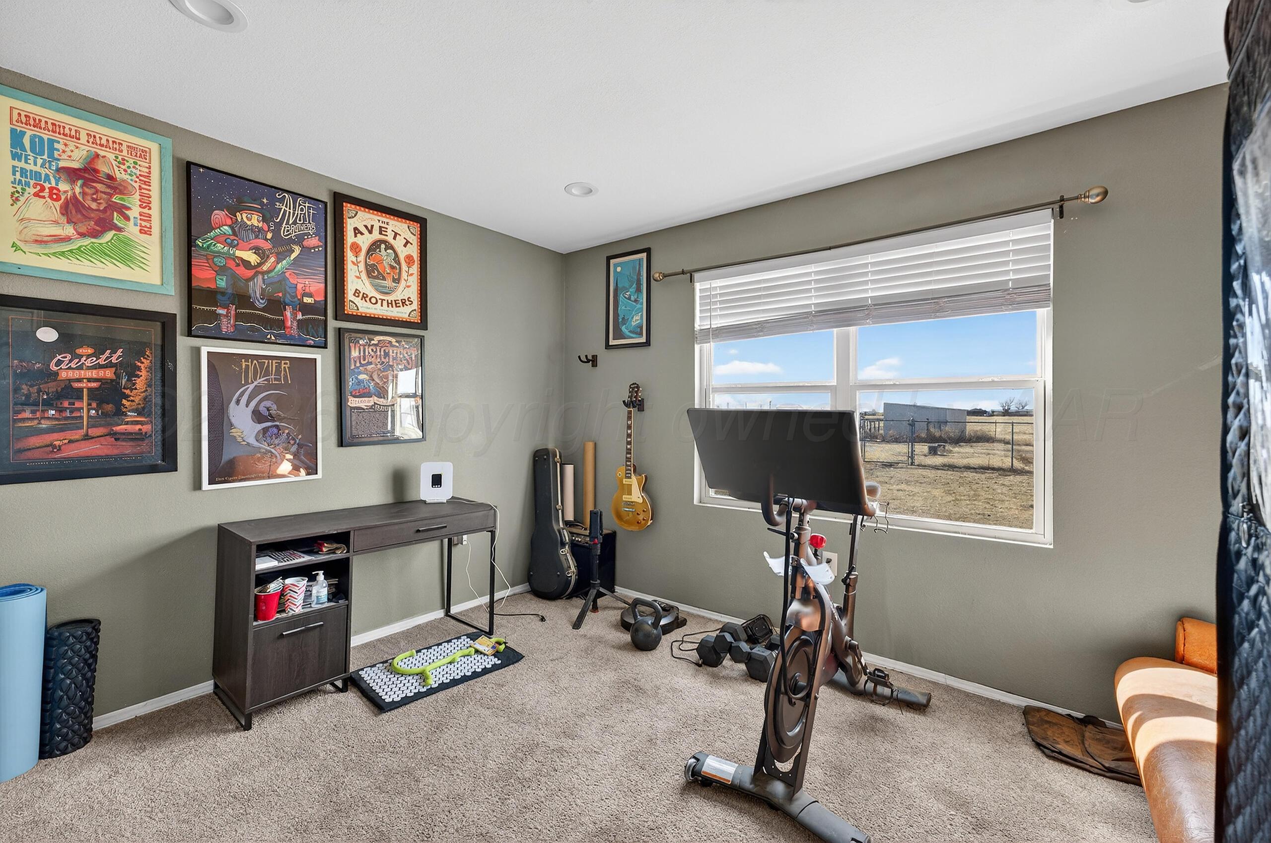 383 County Road 309 Panhandle, TX 79068 - Photo 29 of 35 a room with furniture and a window