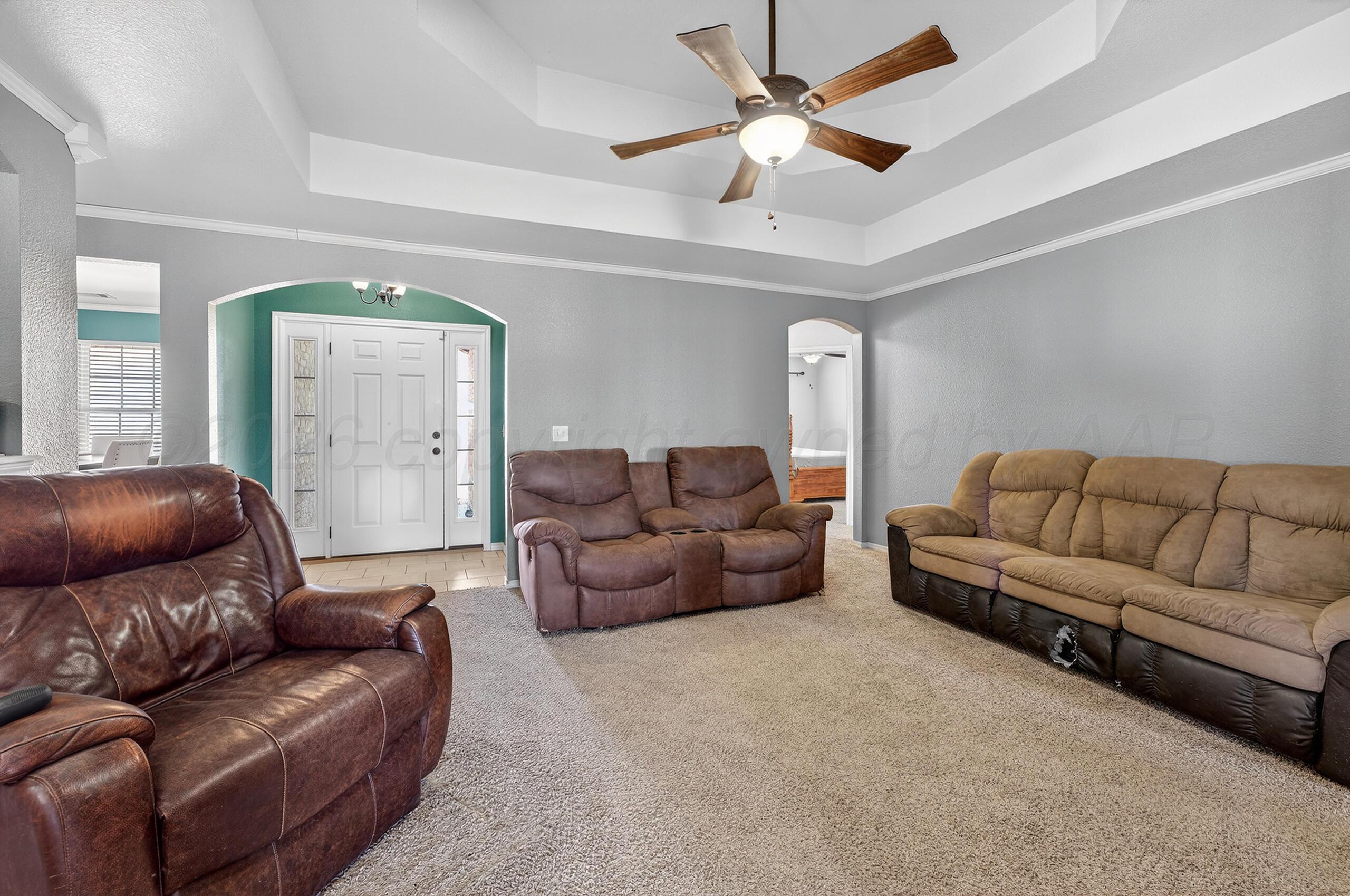 383 County Road 309 Panhandle, TX 79068 - Photo 6 of 35 a living room with furniture and a ceiling fan