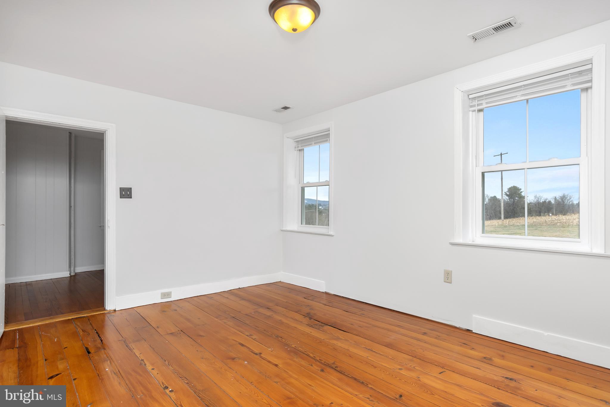2730 Marker Road Middletown, MD 21769 - Photo 28 of 73 a view of an empty room with wooden floor and a window