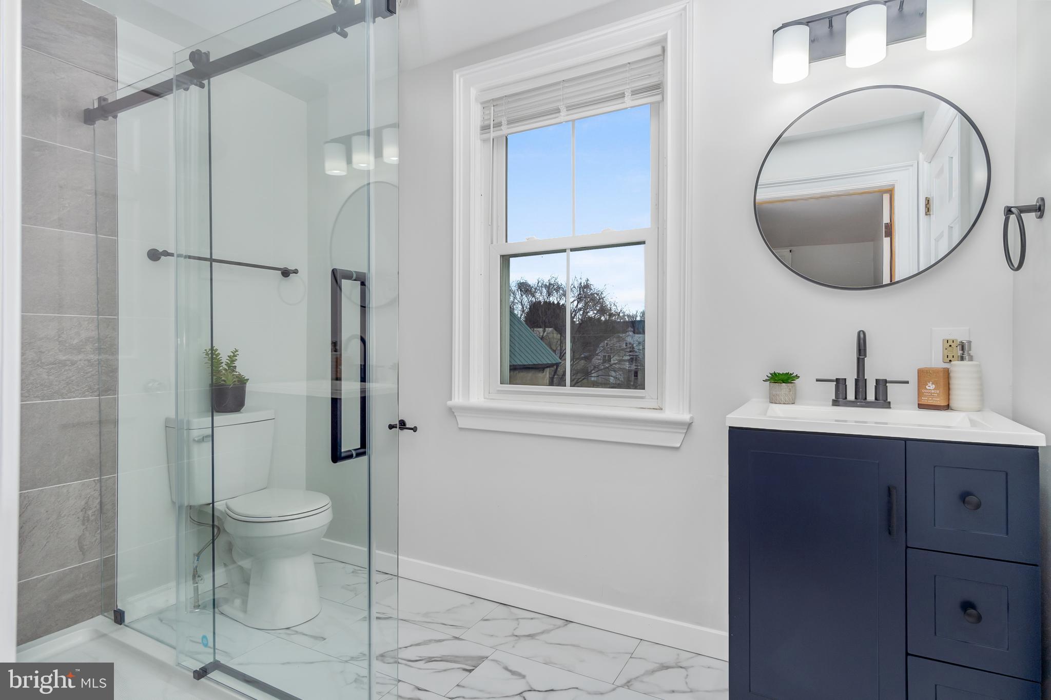 2730 Marker Road Middletown, MD 21769 - Photo 34 of 73 a bathroom with a toilet sink and mirror
