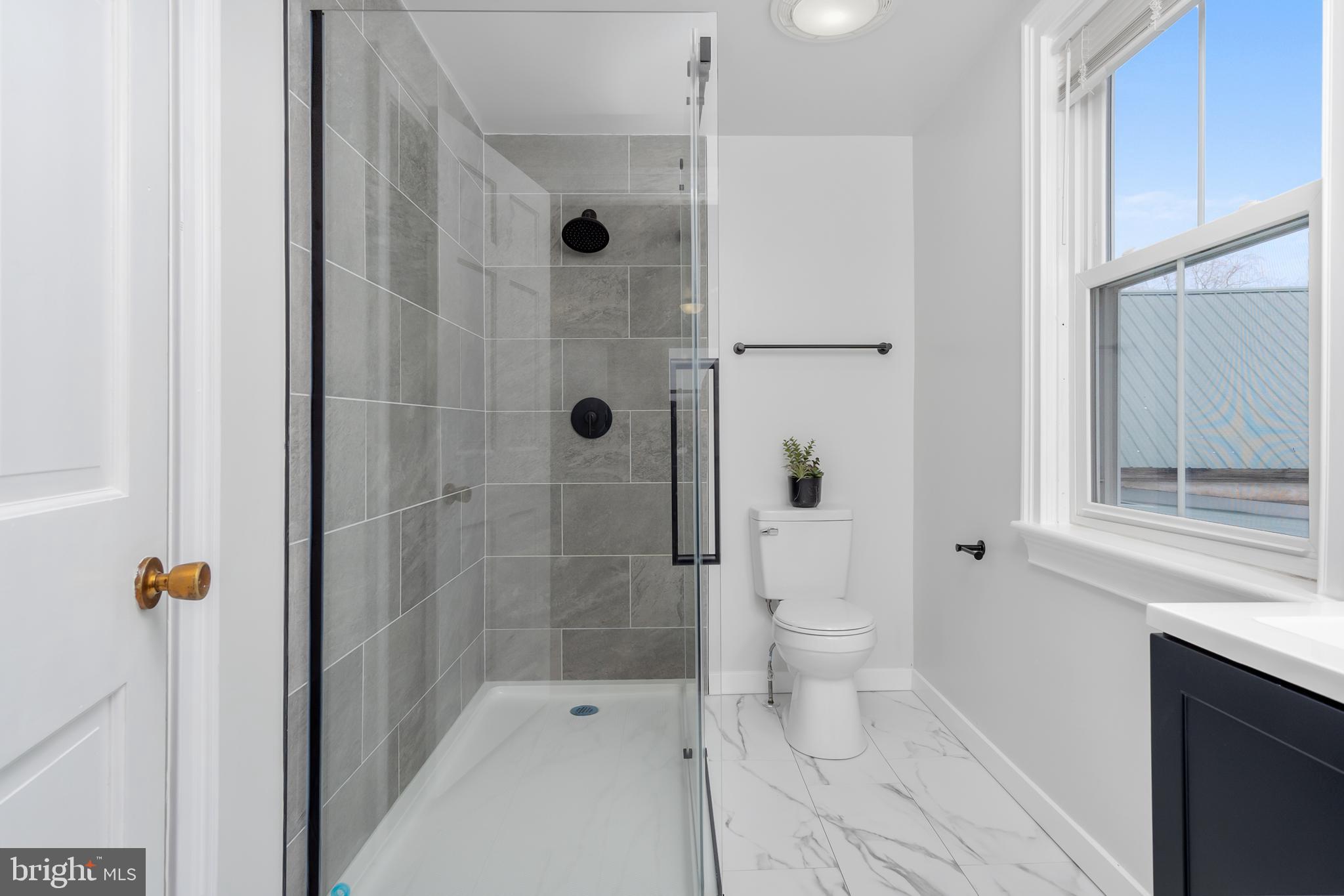 2730 Marker Road Middletown, MD 21769 - Photo 35 of 73 a bathroom with a shower toilet and sink