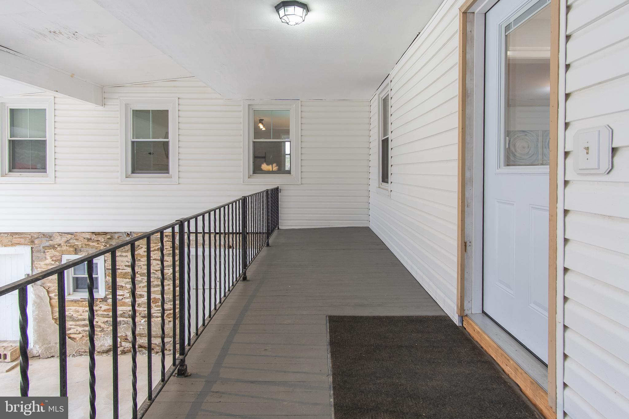 2730 Marker Road Middletown, MD 21769 - Photo 42 of 73 a view of a hallway with wooden floor and windows