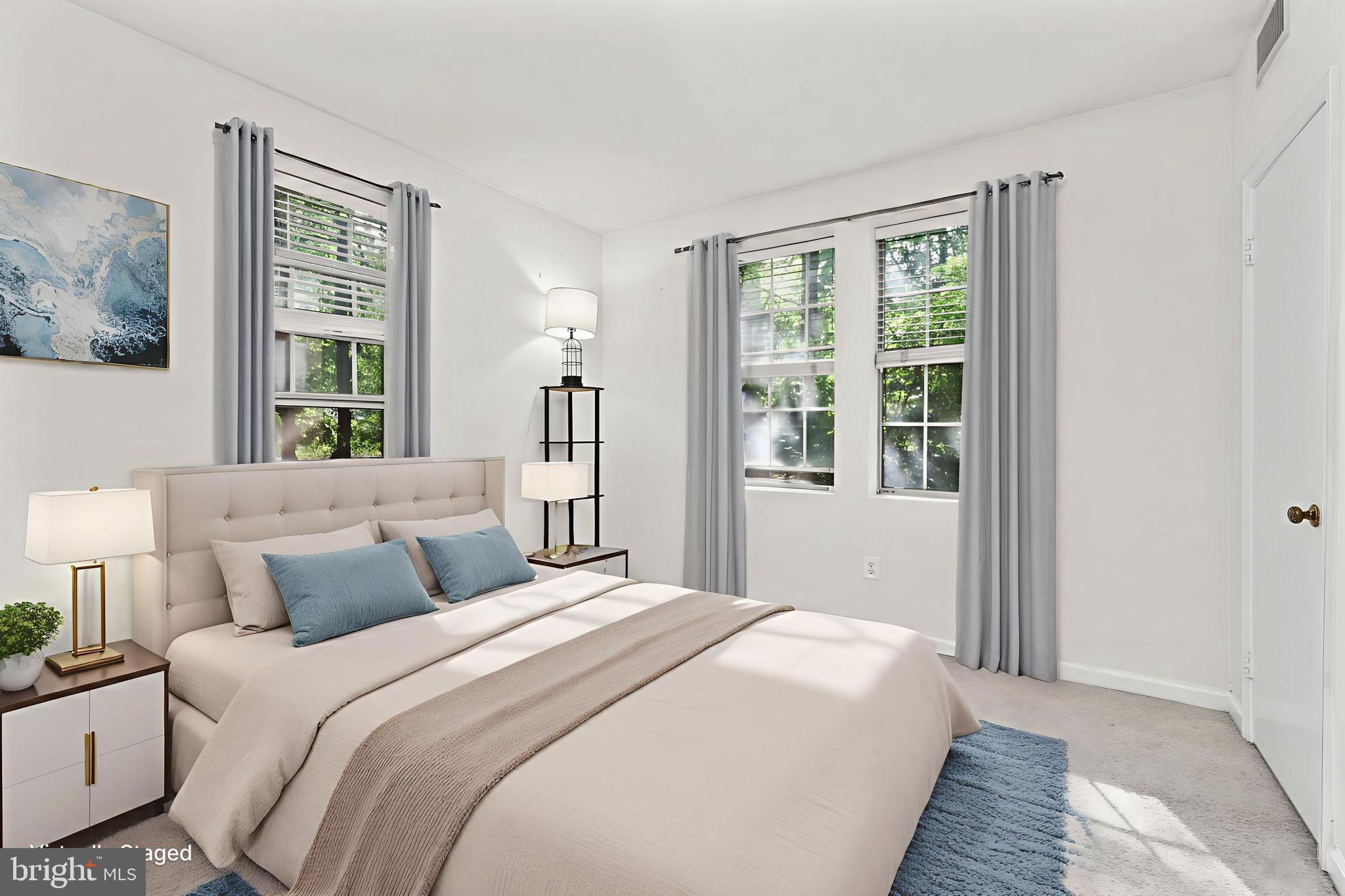 1802 Key Boulevard, Unit 9482 Arlington, VA 22201 - Photo 15 of 28 a bedroom with a large bed and a window