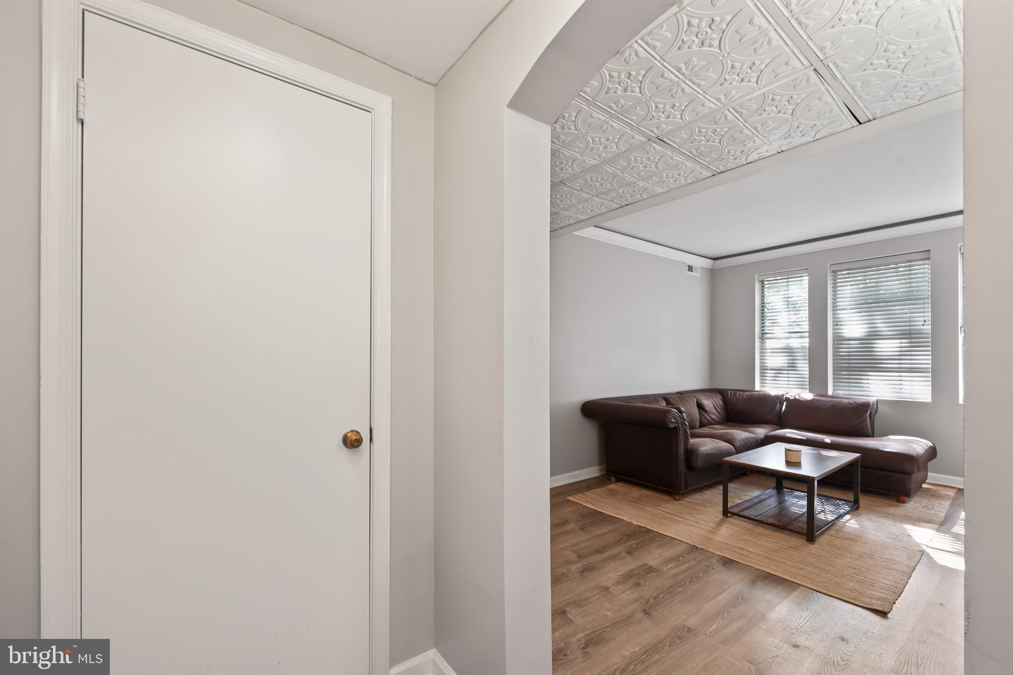 1802 Key Boulevard, Unit 9482 Arlington, VA 22201 - Photo 3 of 28 a living room with furniture and a window