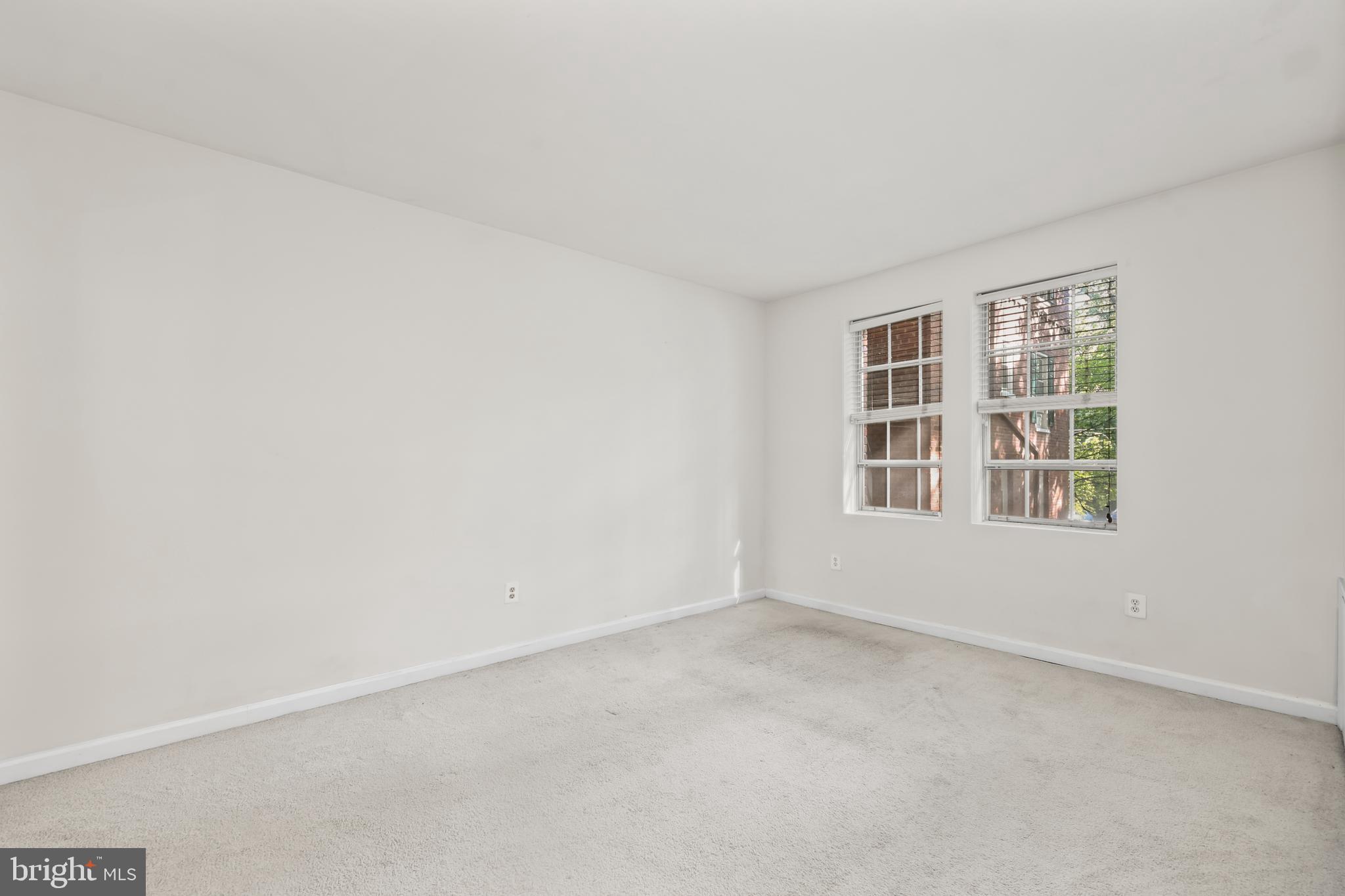 1802 Key Boulevard, Unit 9482 Arlington, VA 22201 - Photo 10 of 28 an empty room with windows
