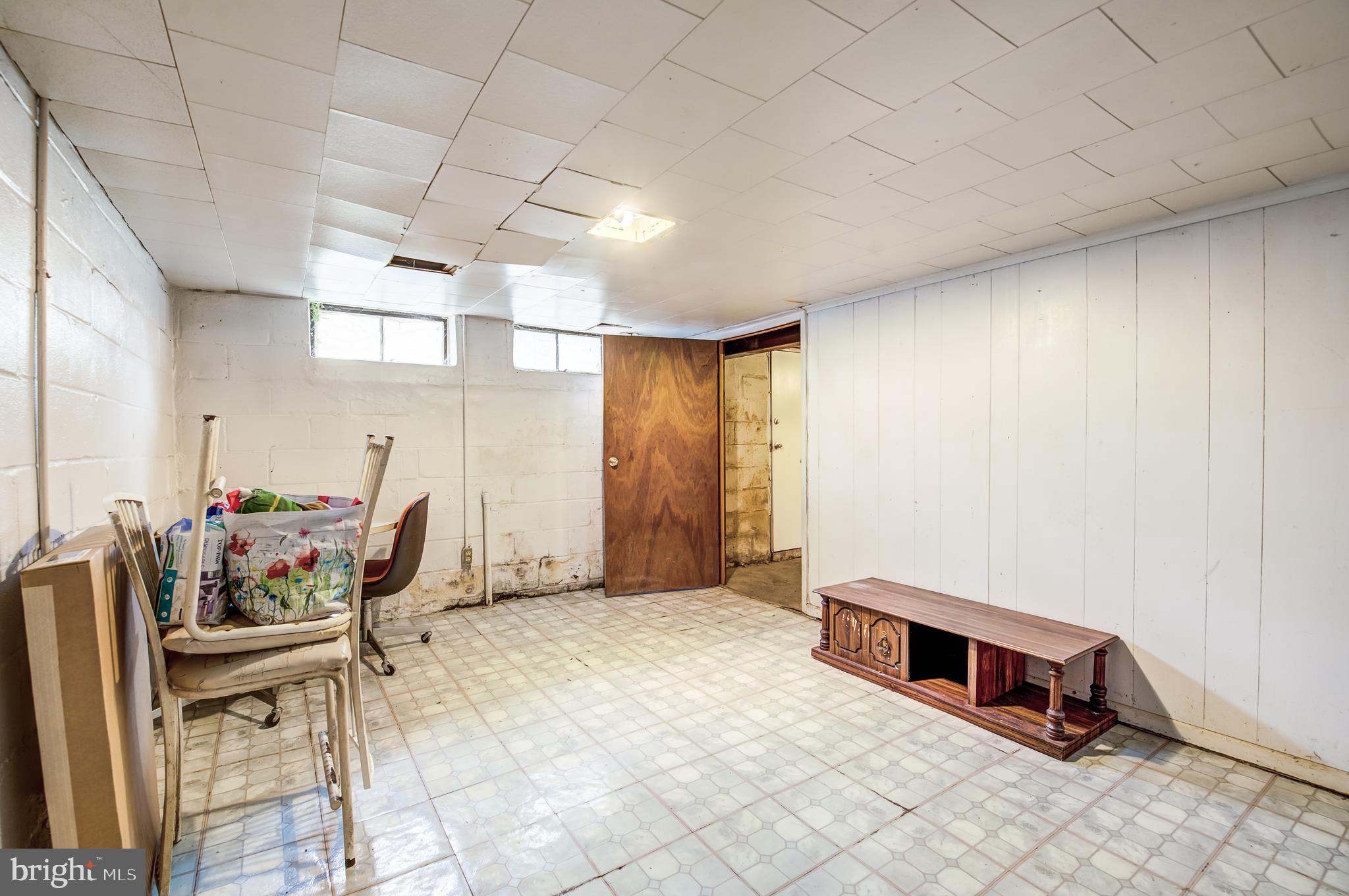 1118 Gleneagle Road Baltimore, MD 21239 - Photo 6 of 16 a room with furniture and window