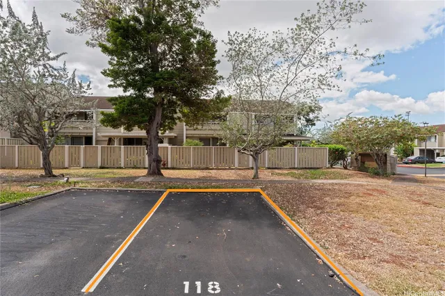 a front view of a house with a yard and a garage