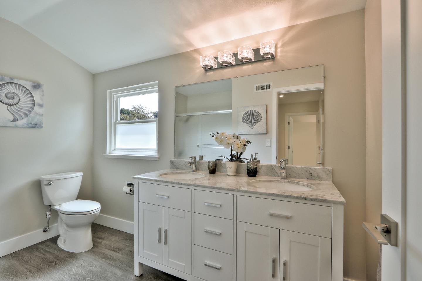 2522 Katrina Way Mountain View, CA 94040 - Photo 32 of 40 a bathroom with double vanity sink a toilet and a mirror