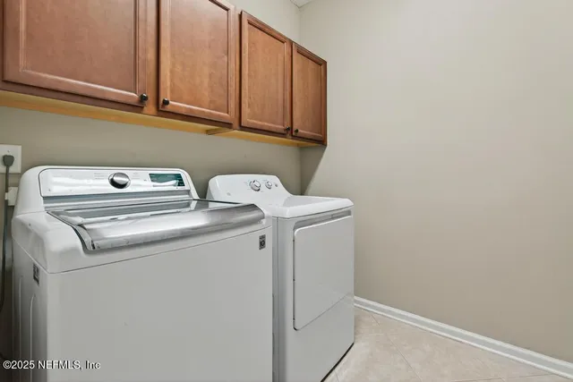a bed room with a bed window and a wooden floor