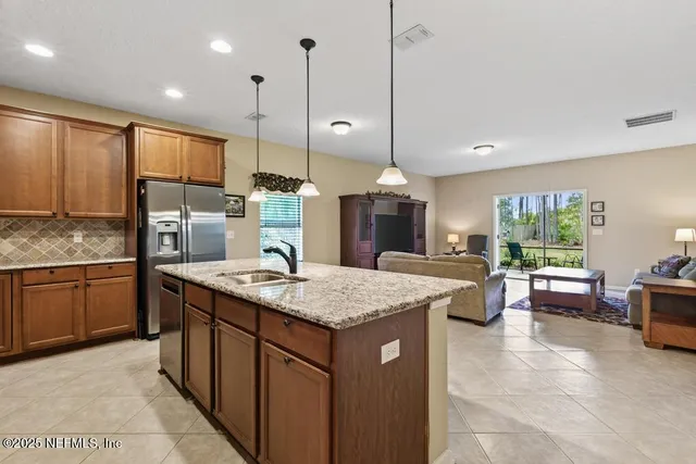 a spacious bedroom with a bed and wooden floor