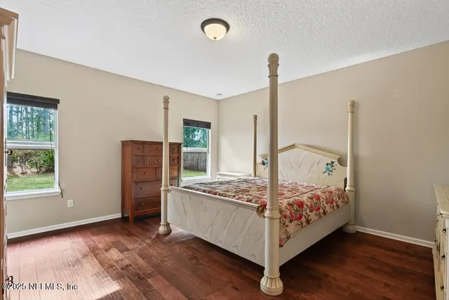 a bathroom with a toilet and a shower curtain