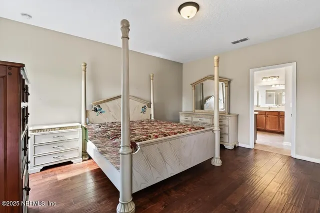 a view of a two chairs in the garden