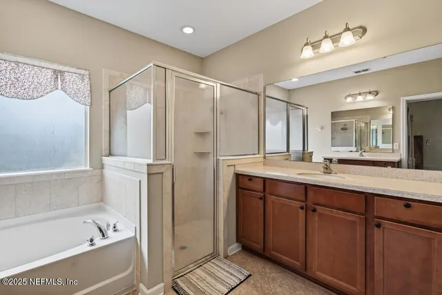 a view of a chair and table in backyard of the house