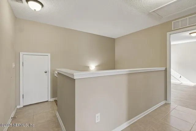 an aerial view of residential house with outdoor space and swimming pool