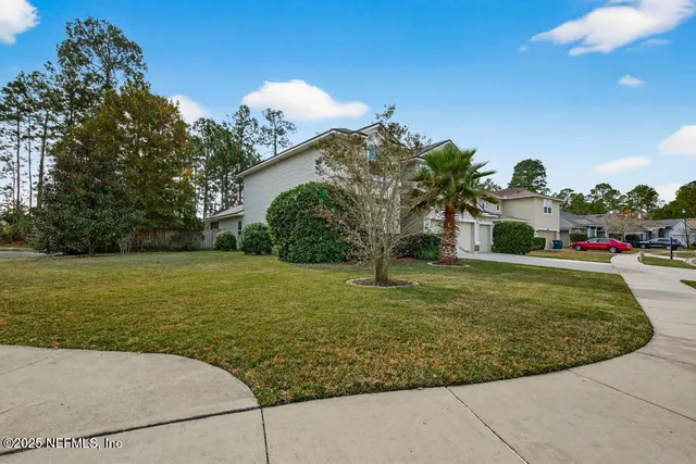 a view of a pathway besides a house