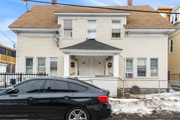 a car parked in front of a house