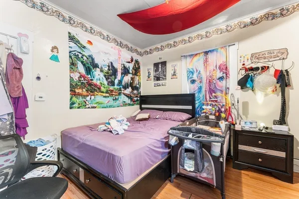 a bedroom with a bed and furniture