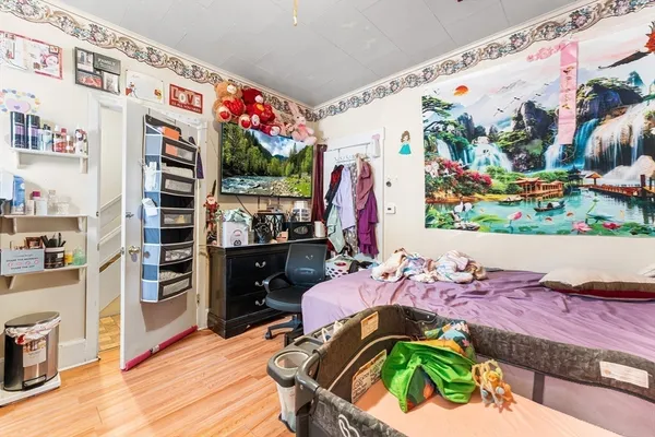 a bed room with a bed and a lamp