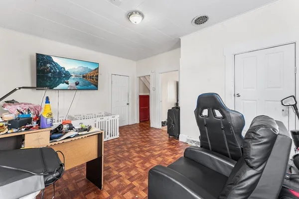 a bedroom with a bed and flat screen tv