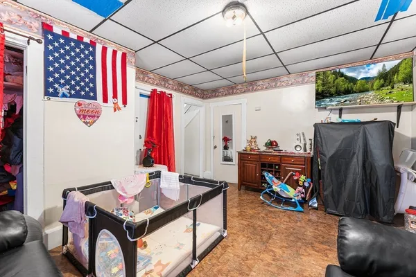 a room with lots of furniture and air hockey table