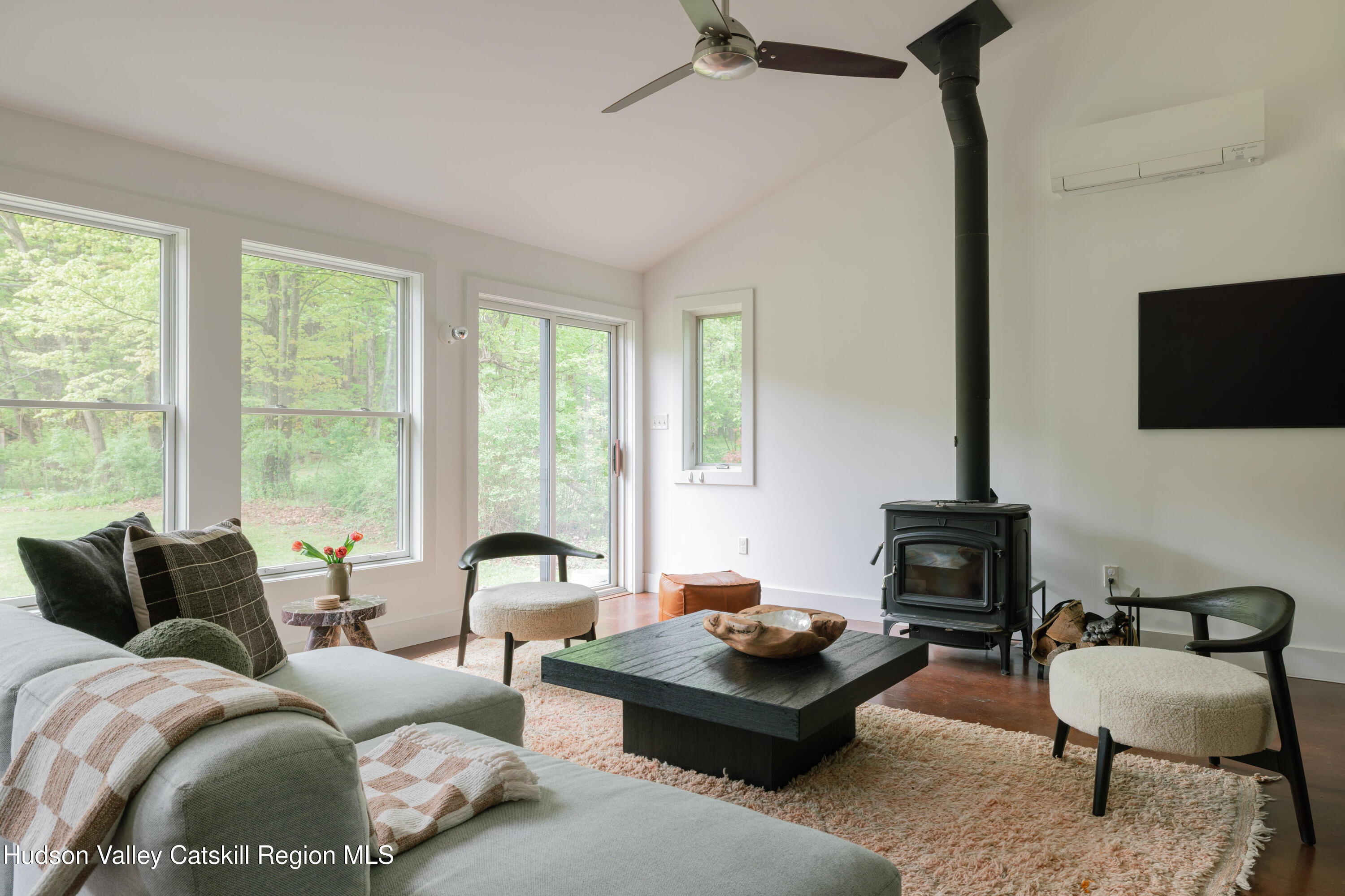 631 Granite Road Kerhonkson, NY 12446 - Photo 11 of 27 a living room with furniture a flat screen tv and a window